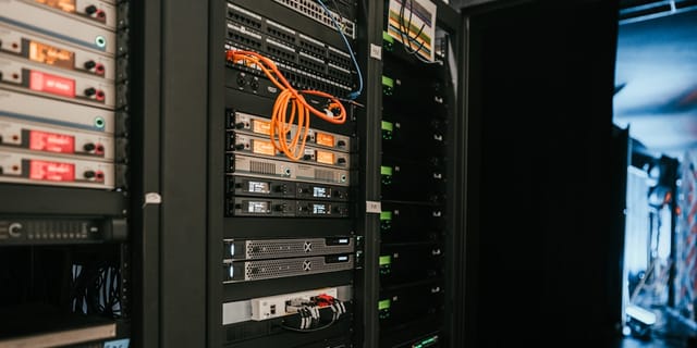 a rack of servers in a server room