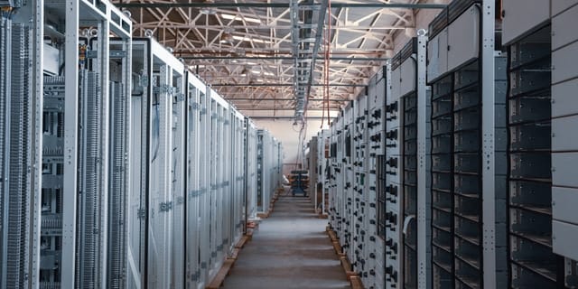 A server rack with GPU cards in a data center, illustrating vLLM inference hardware.