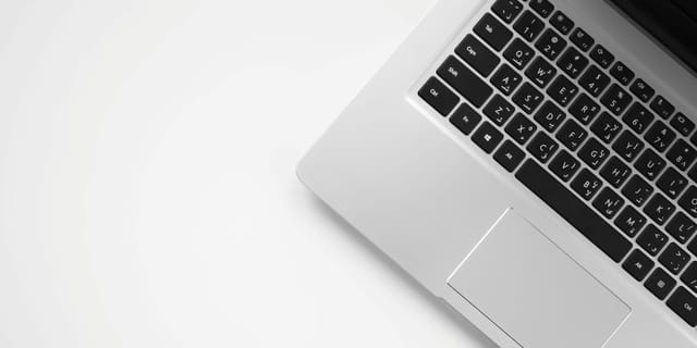 MacBook Pro on white surface