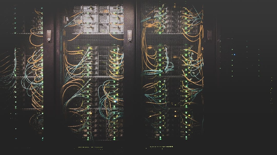 Row of GPU server racks with illuminated status lights in a data center
