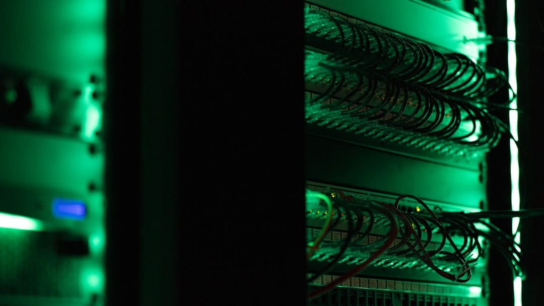 Rows of server racks in a data center with cooling cables